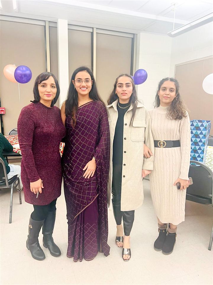 Ravinder Kaur Sidhu with colleagues at a team celebration