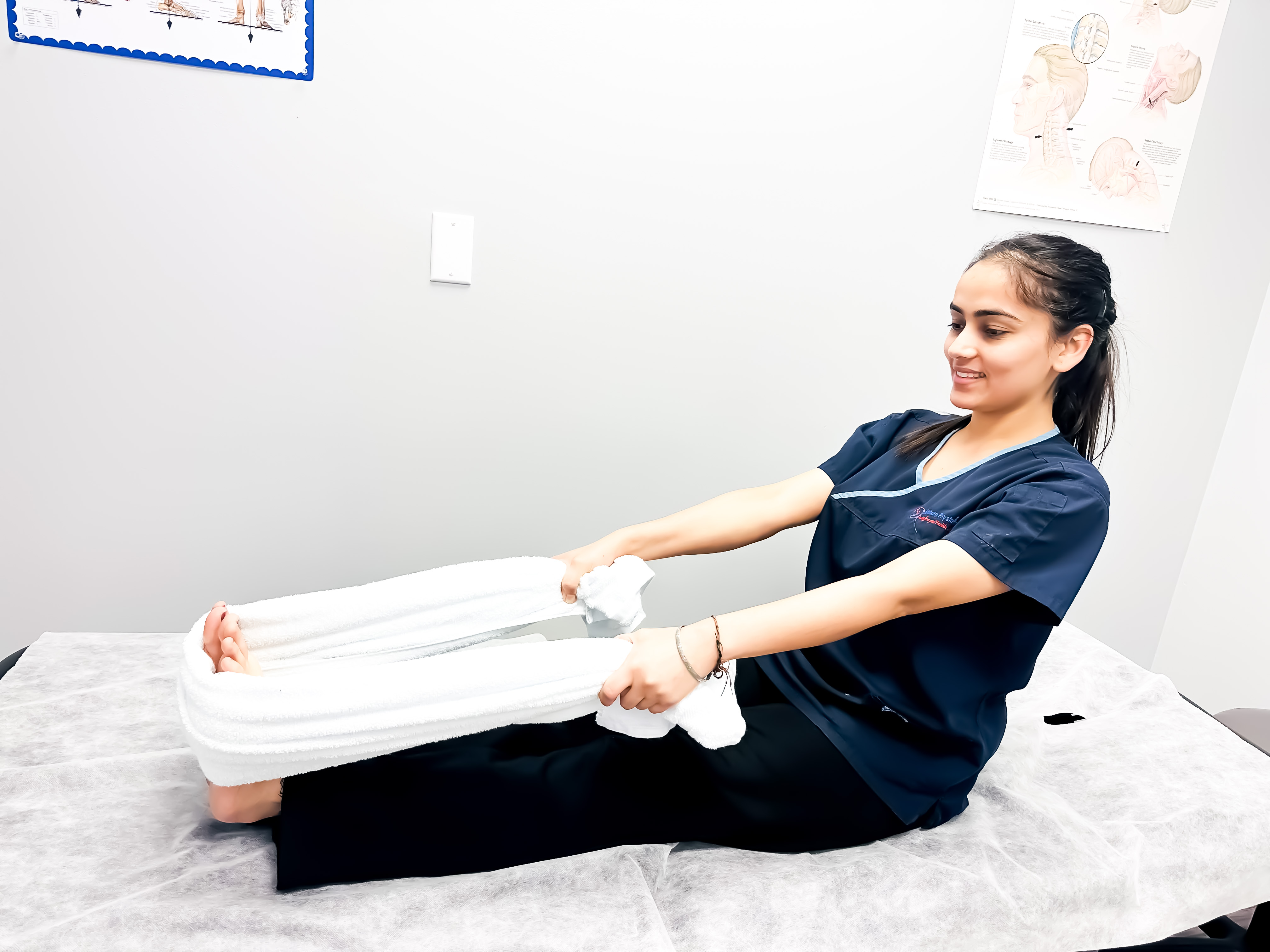 Towel stretch therapy session
